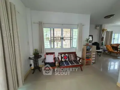 Charming living room with cozy seating and natural light