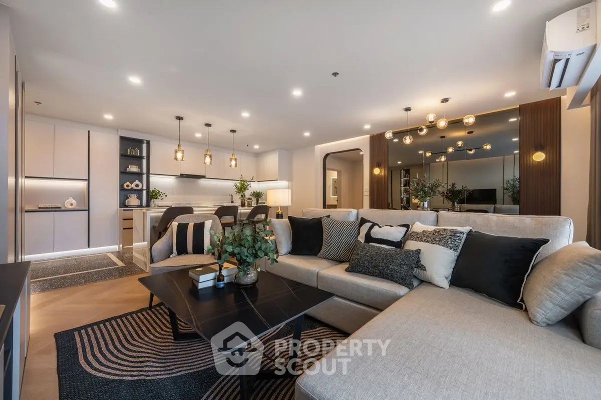 Luxurious modern living room with stylish decor and open kitchen layout