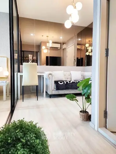 Modern living room with elegant decor and stylish lighting in a cozy apartment.