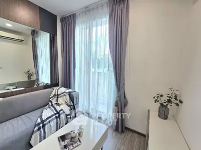 Modern living room with cozy sofa, elegant curtains, and natural light