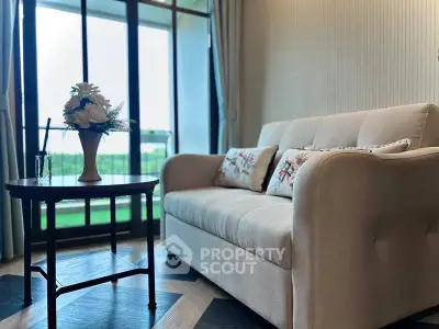 Cozy living room with elegant sofa and large window view