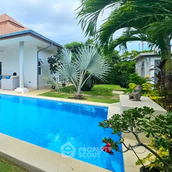 Stunning villa with private pool and lush garden, perfect for luxury living.