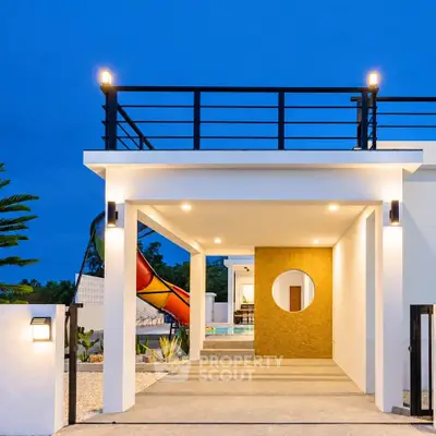 Modern luxury home entrance with sleek design and rooftop terrace at dusk.