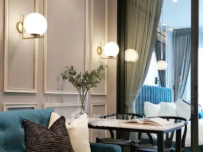 Elegant living room with modern decor and plush seating, featuring stylish lighting and a cozy ambiance.