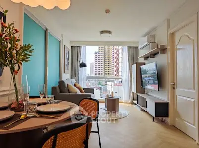 Stylish living room with modern decor and city view, perfect for urban living.