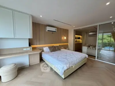 Spacious modern bedroom with elegant decor and cozy ambiance