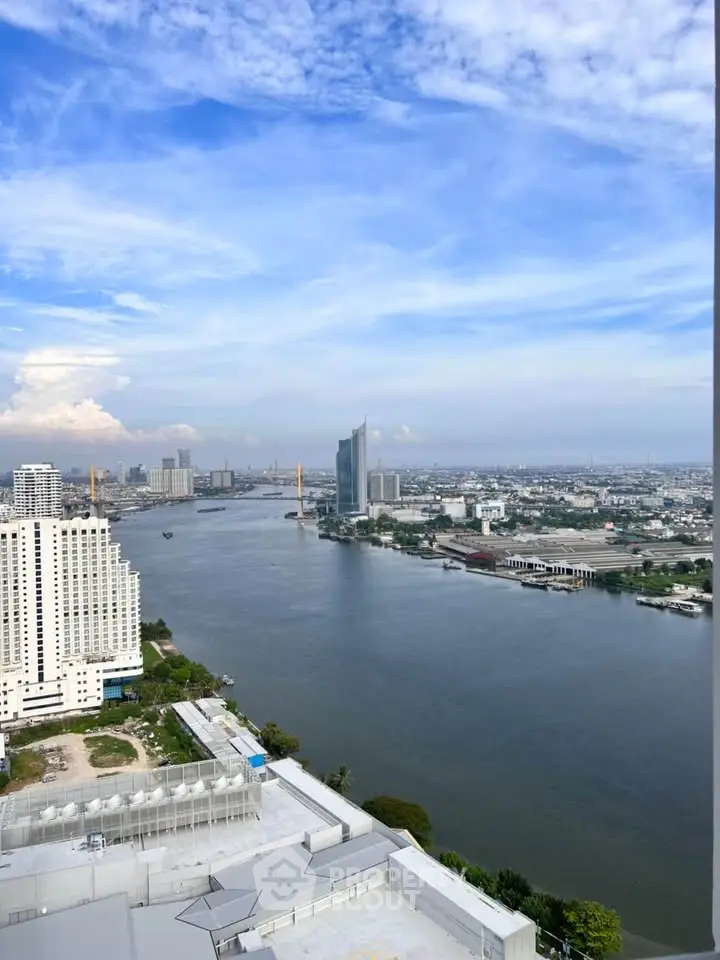 Stunning high-rise river view showcasing urban skyline and serene waterway.