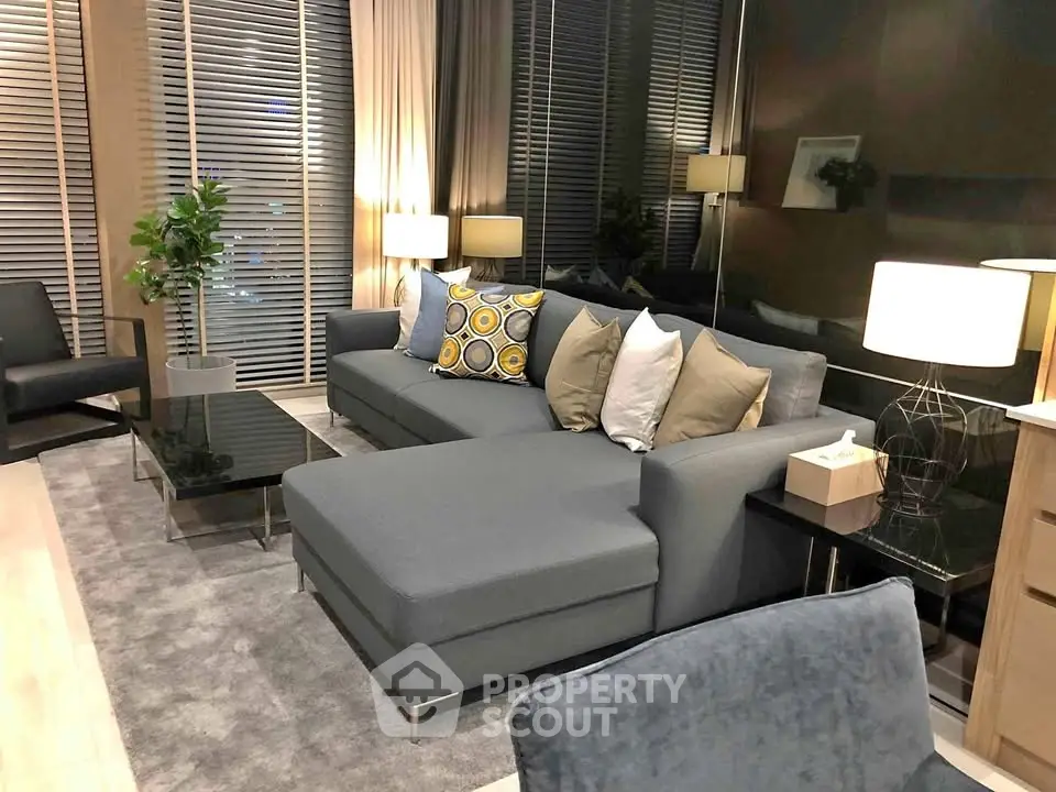 Modern living room with stylish gray sofa and elegant decor