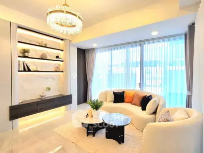 Luxurious living room with elegant chandelier and modern decor