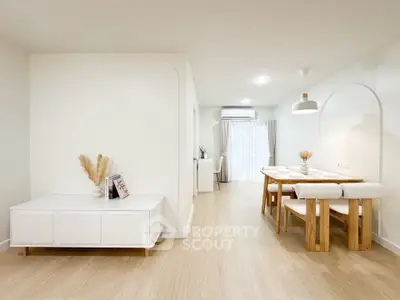 Modern dining area with minimalist decor and natural light