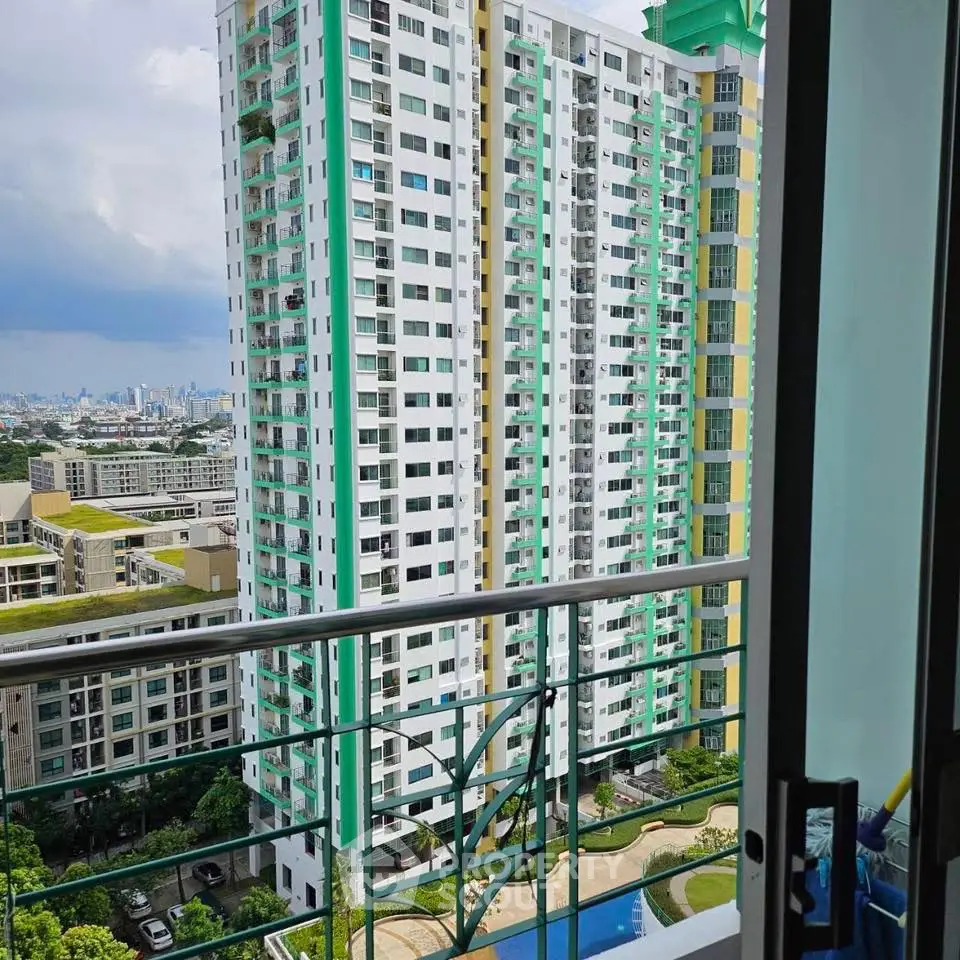 Stunning high-rise apartment view with pool and cityscape