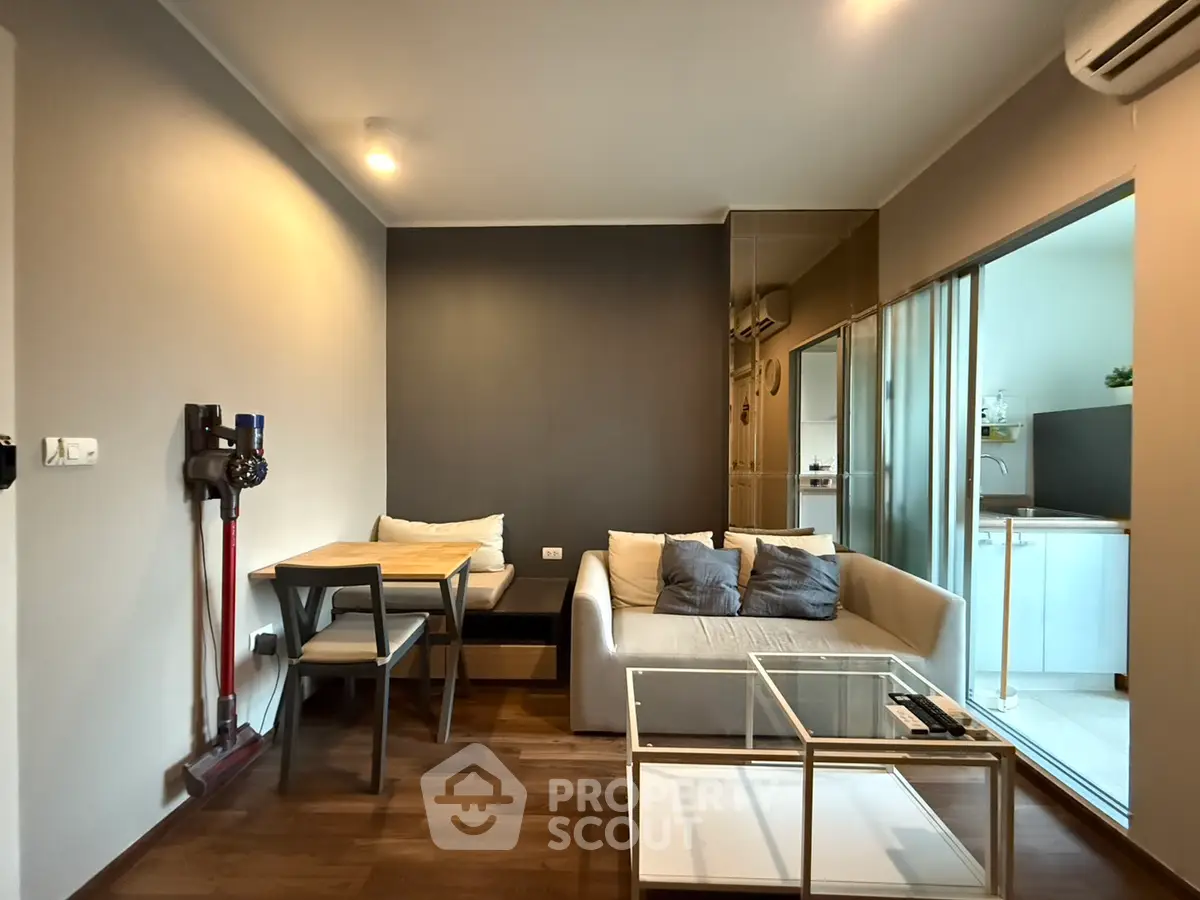 Modern living room with cozy sofa and dining area in stylish apartment