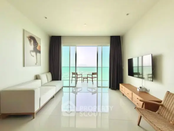 Spacious modern living room with stunning ocean view and elegant decor