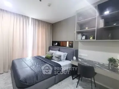 Modern bedroom with stylish decor and workspace in luxury apartment