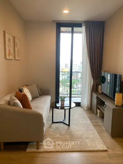 Cozy living room with modern decor and city view balcony