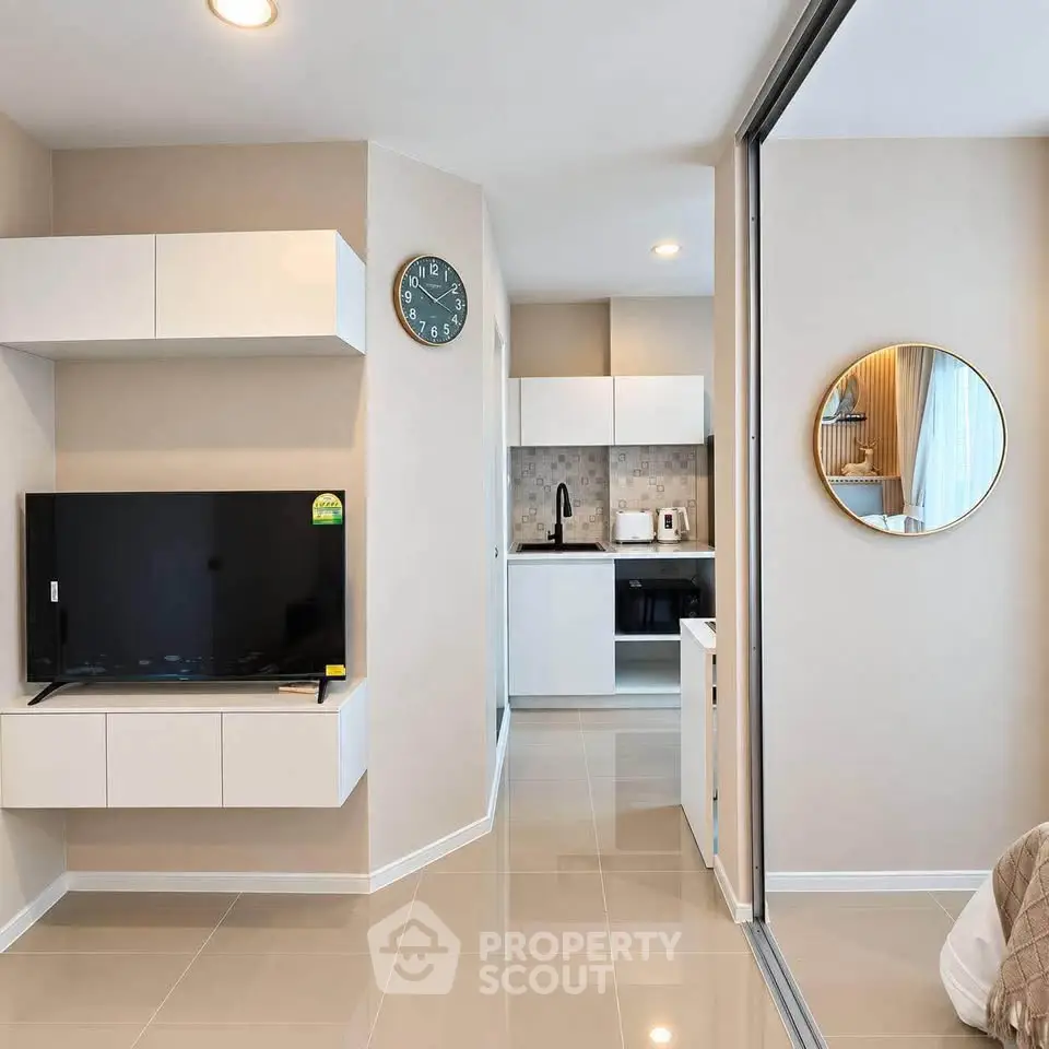 Modern apartment interior with sleek kitchen and cozy living area