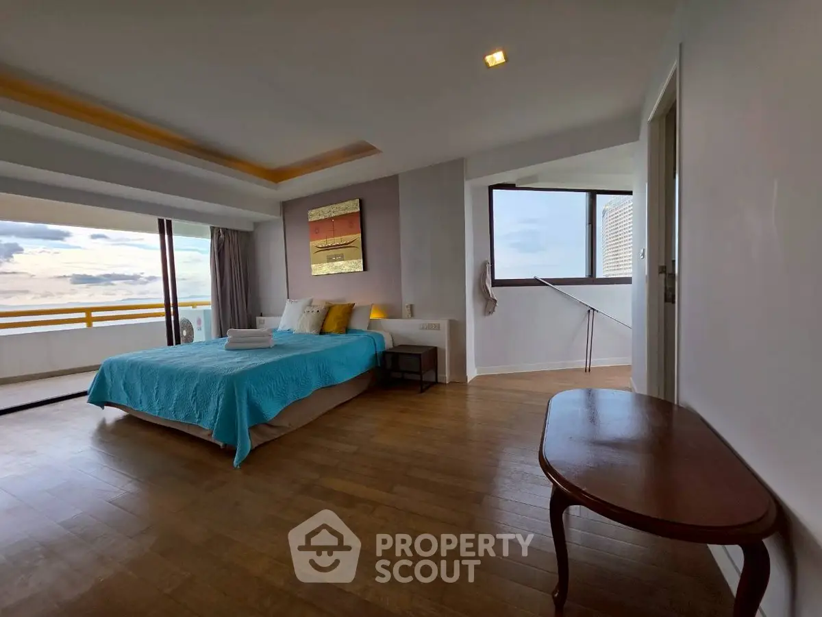 Spacious bedroom with ocean view and elegant decor