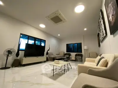 Spacious modern living room with elegant decor and large windows