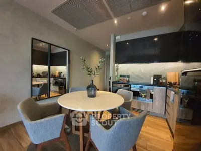 Modern kitchen with stylish dining area and sleek appliances