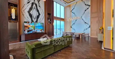 Luxurious living room with high ceilings, elegant decor, and stunning city view.