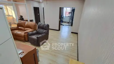 Spacious living room with modern furniture and wooden flooring