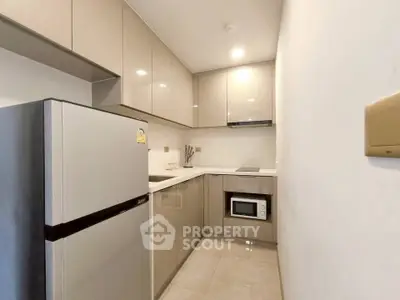 Modern kitchen with sleek cabinetry and built-in appliances