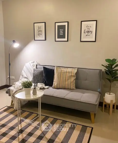 Cozy living room with stylish sofa and decor accents
