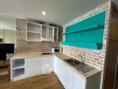 Modern kitchen with brick accent wall and open shelving