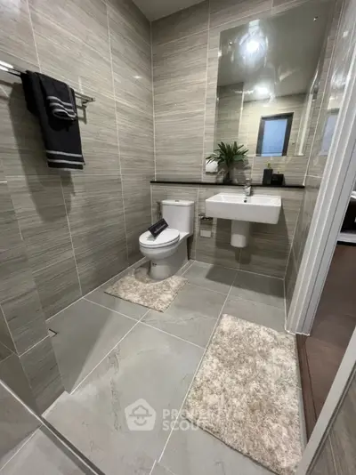 Modern bathroom with sleek tiles and contemporary fixtures