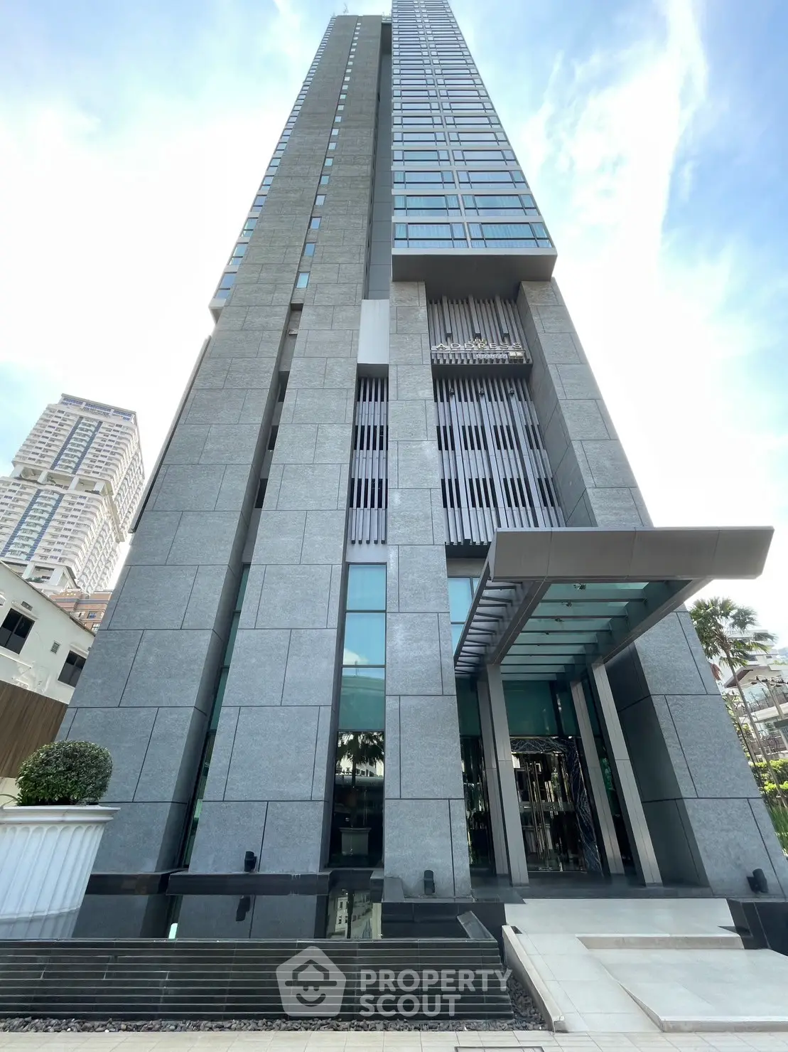 Stunning modern high-rise building with sleek architectural design and glass facade in urban setting.
