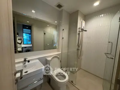 Modern bathroom with glass shower and sleek fixtures