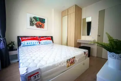 Modern bedroom with stylish decor and ample storage in a cozy apartment