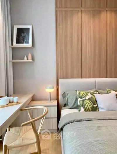 Modern bedroom with stylish decor and cozy ambiance, featuring wooden accents and elegant lighting.