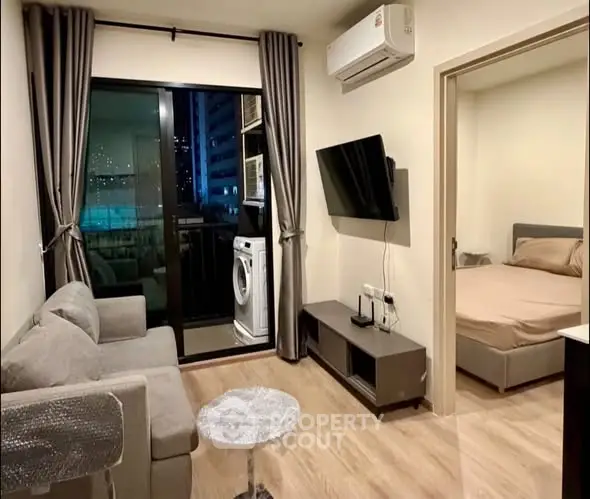 Modern apartment living room with balcony and bedroom view