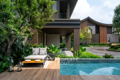Luxurious modern home with pool and lush garden, perfect for relaxation and entertaining.