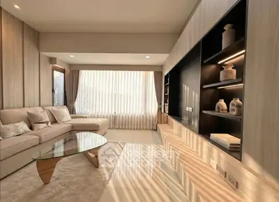 Luxurious living room with modern decor and large windows