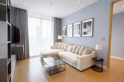 Modern living room with stylish decor and large windows for natural light