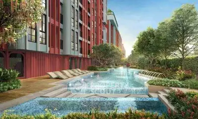 Luxurious apartment complex with stunning pool and lush greenery, perfect for relaxation and leisure.