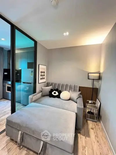 Modern living room with stylish decor and open kitchen layout