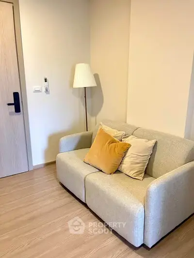 Cozy living room with modern sofa and stylish floor lamp