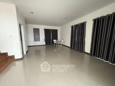 Spacious modern living room with elegant curtains and minimalist decor
