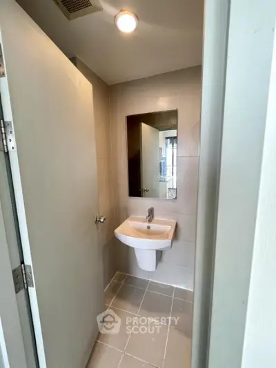 Modern minimalist bathroom with sleek sink and mirror