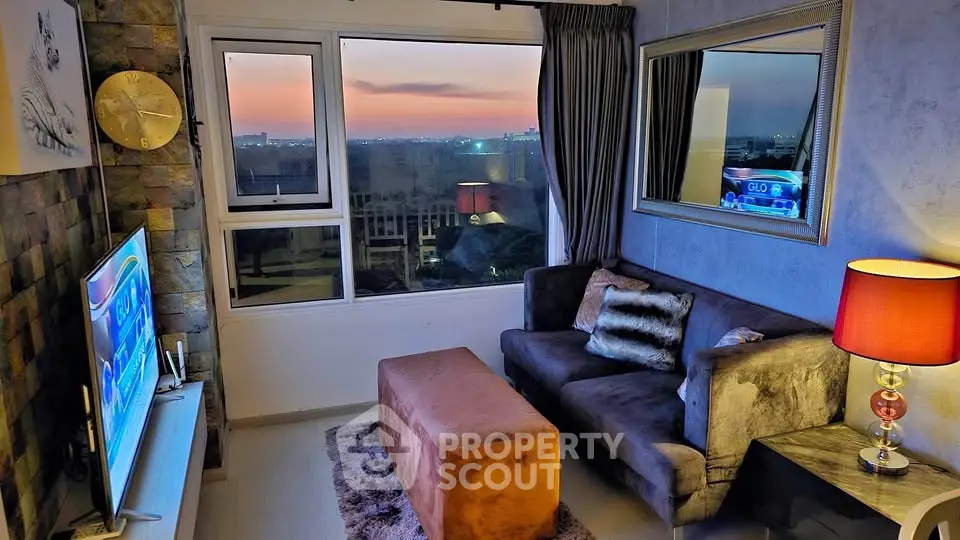 Cozy living room with stunning sunset view, plush sofa, and modern decor.