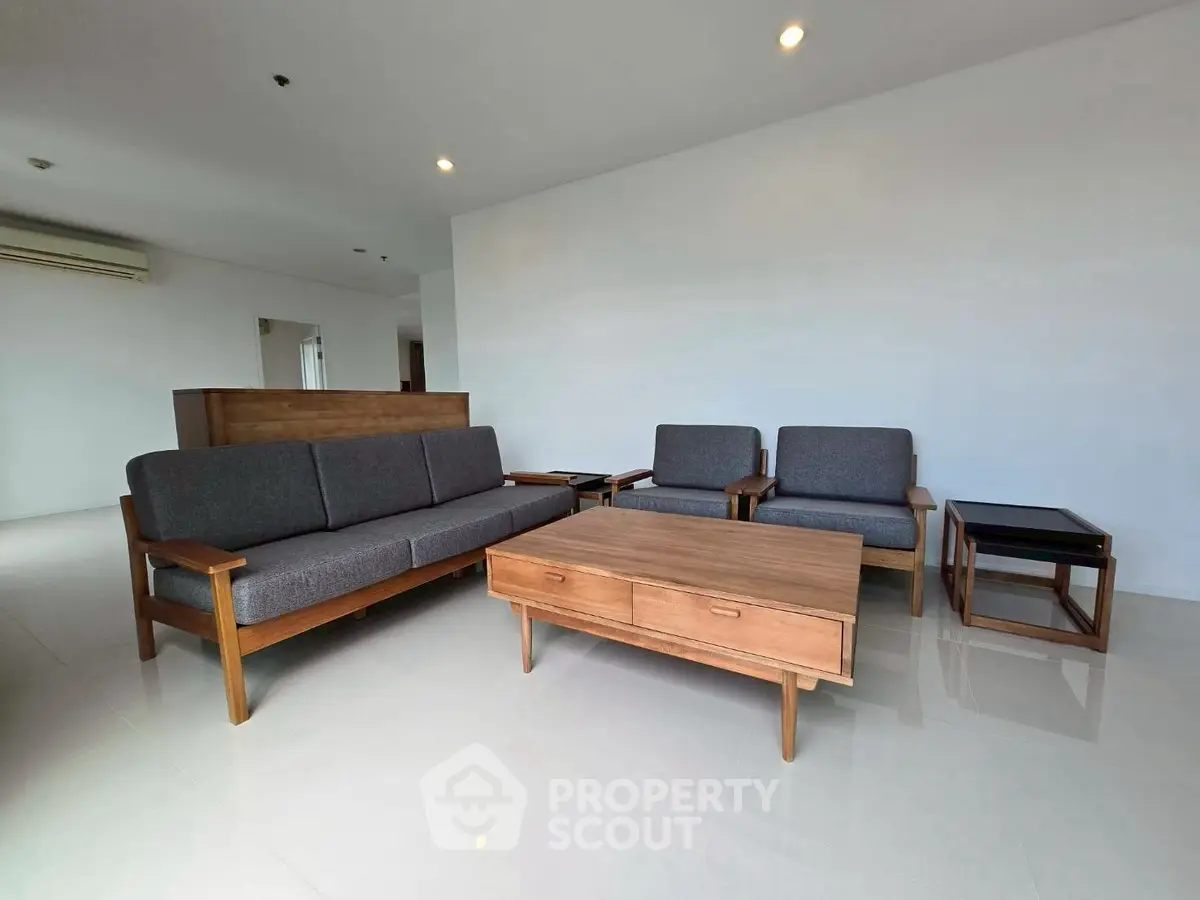 Spacious living room with modern wooden furniture and sleek design