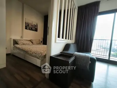 Modern bedroom with balcony view and stylish decor in urban apartment