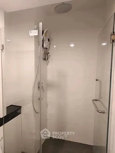 Modern bathroom with sleek shower design and contemporary fixtures.