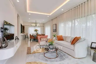 Elegant living room with modern decor and large windows for natural light.