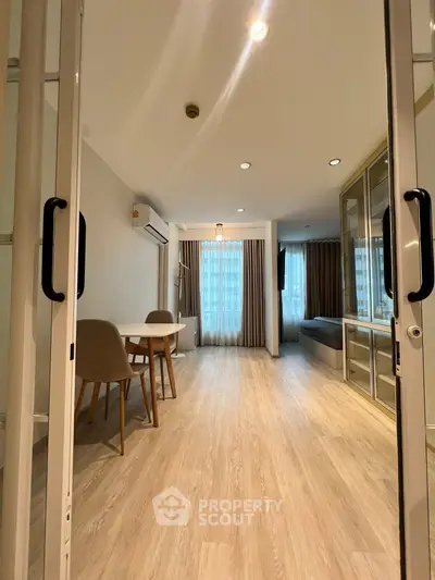 Spacious modern living room with elegant decor and large windows