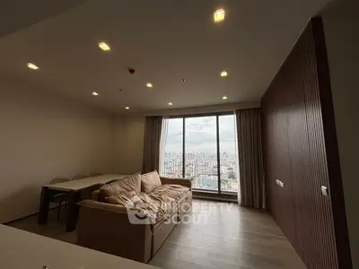 Spacious living room with panoramic city view and modern decor