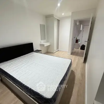 Spacious bedroom with modern design and ample natural light